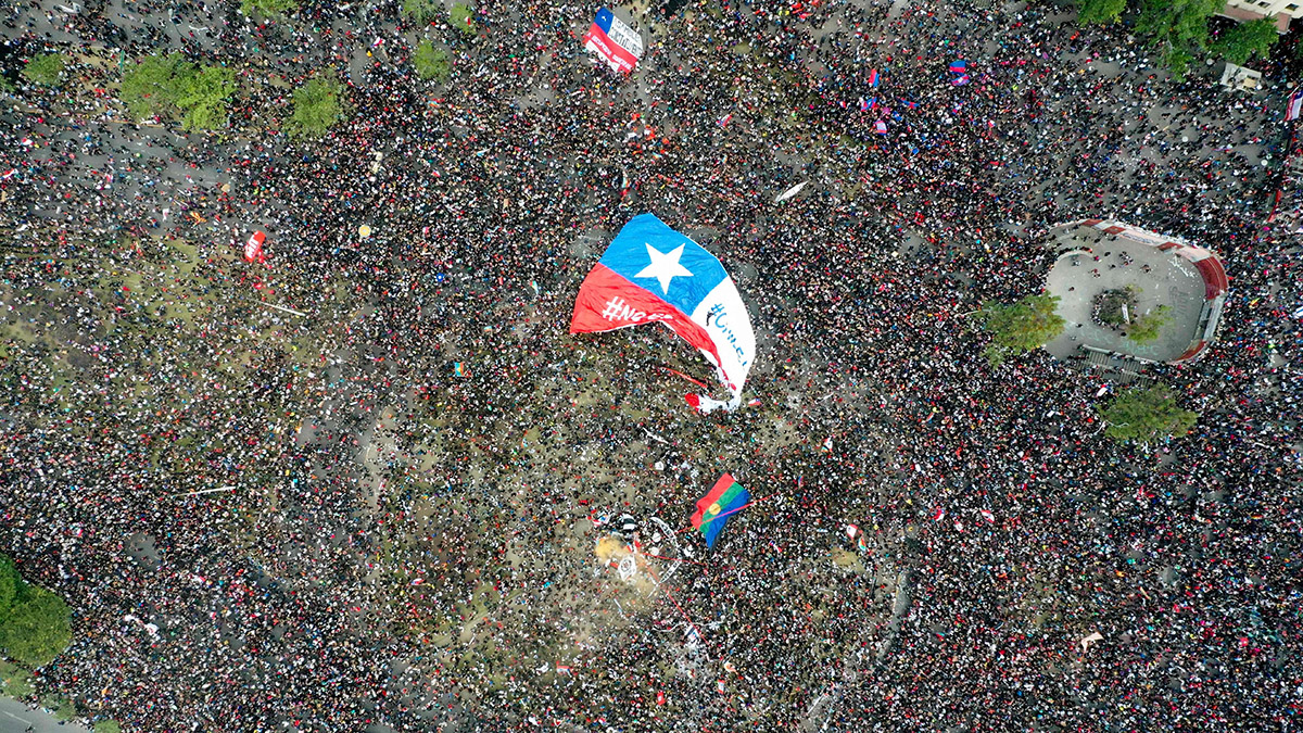 An aerial image of people protesting in Santiago, Chile.