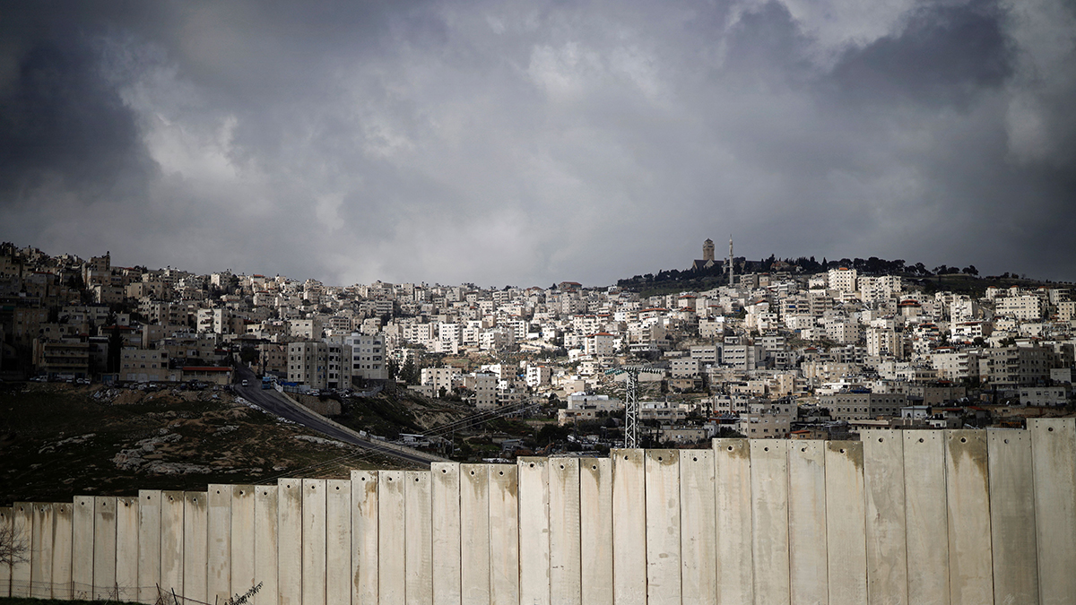 An Israeli barrier separates the Palestinian West Bank village of Eizariya, the Biblical Bethany, and Jerusalem.