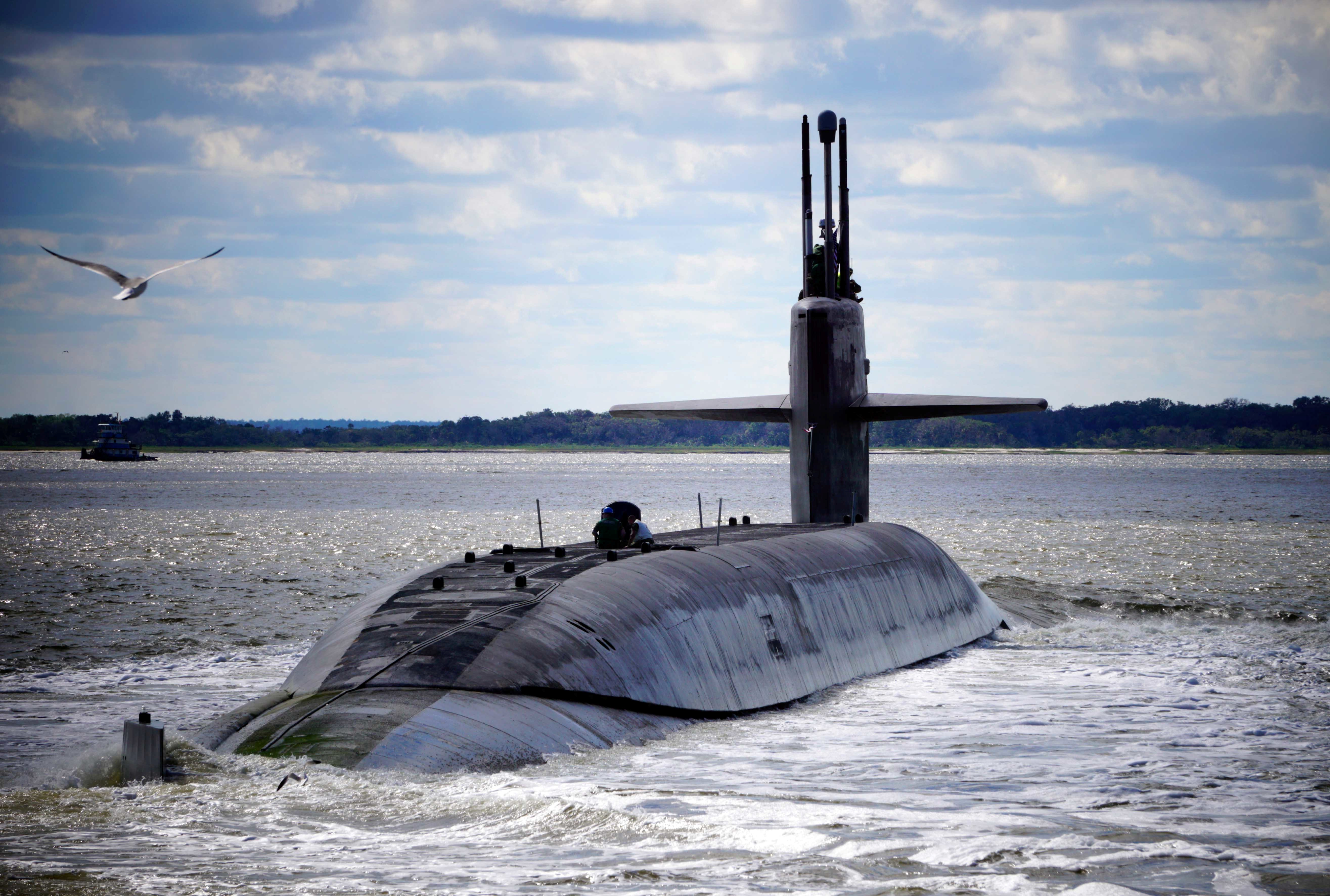 The U.S. ballistic missile submarine U.S.S. Alaska emerges from the ocean.
