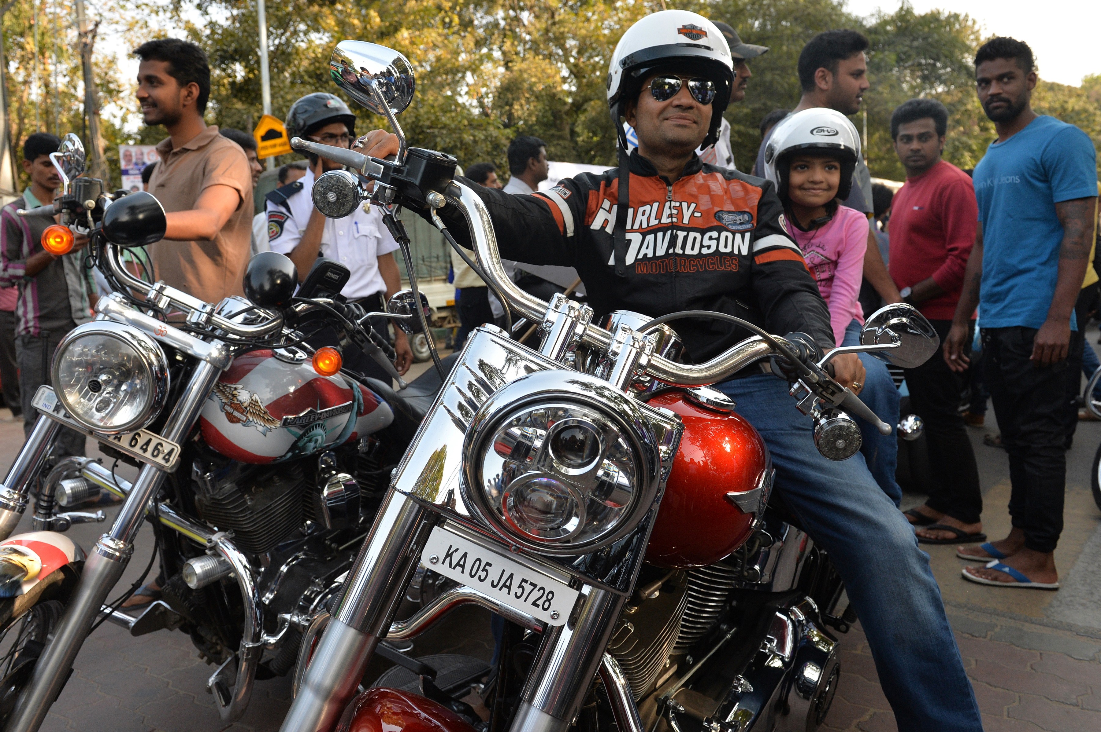 An Indian owner of a Harley Davidson motorcycle poses as he takes part in a bike rally on the streets of Bangalore on February 1, 2015.