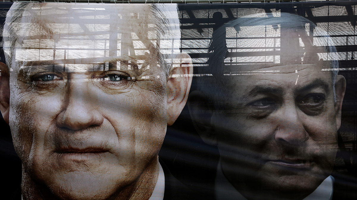 A banner with Benny Gantz's face next to the semi-translucent face of Israeli Prime Minister Benjamin Netanyahu.