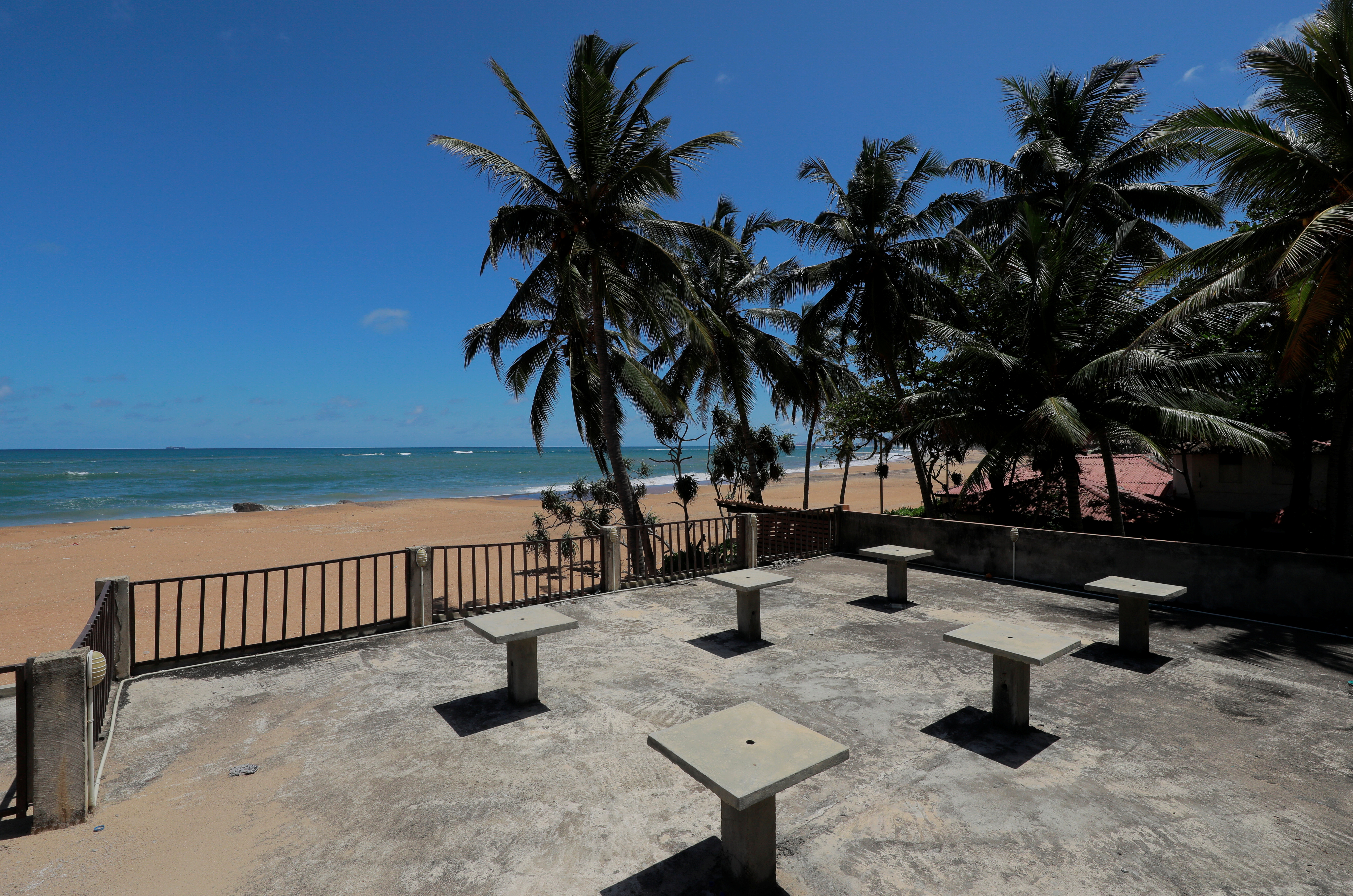 Empty tables near a beach