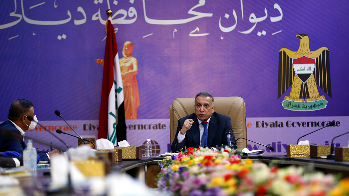 Iraqi Prime Minister Mustafa al-Kadhimi speaks during a meeting with a Diyala governor.