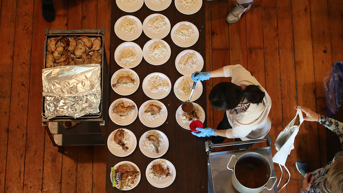 An overhead view of charity workers in Toronto setting up takeout-style service for Thanksgiving.