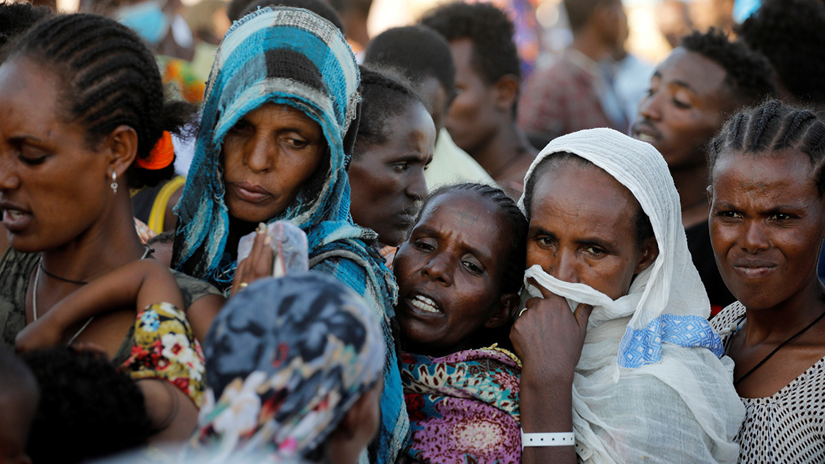 Refugees who fled the fighting in Tigray stand in line for supplies at the Um Rakuba camp near the Sudan border.