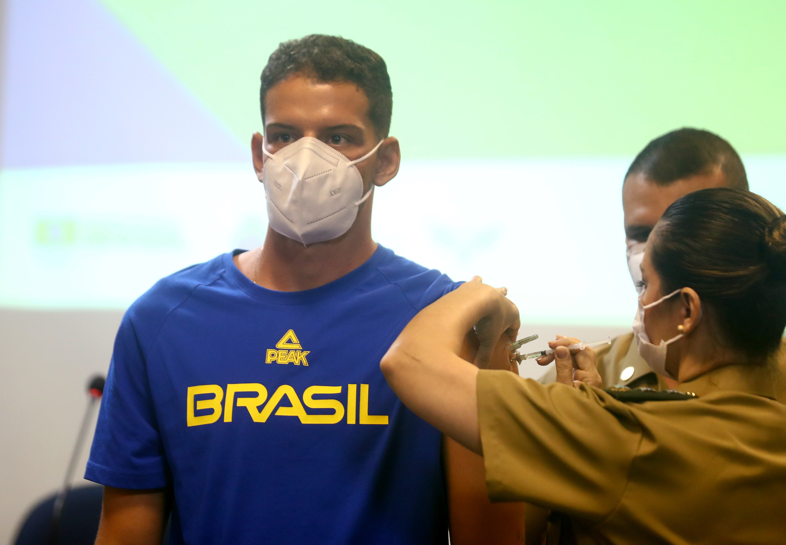 A Brazilian athlete receives a COVID-19 vaccine ahead of traveling to Tokyo for the Olympics.