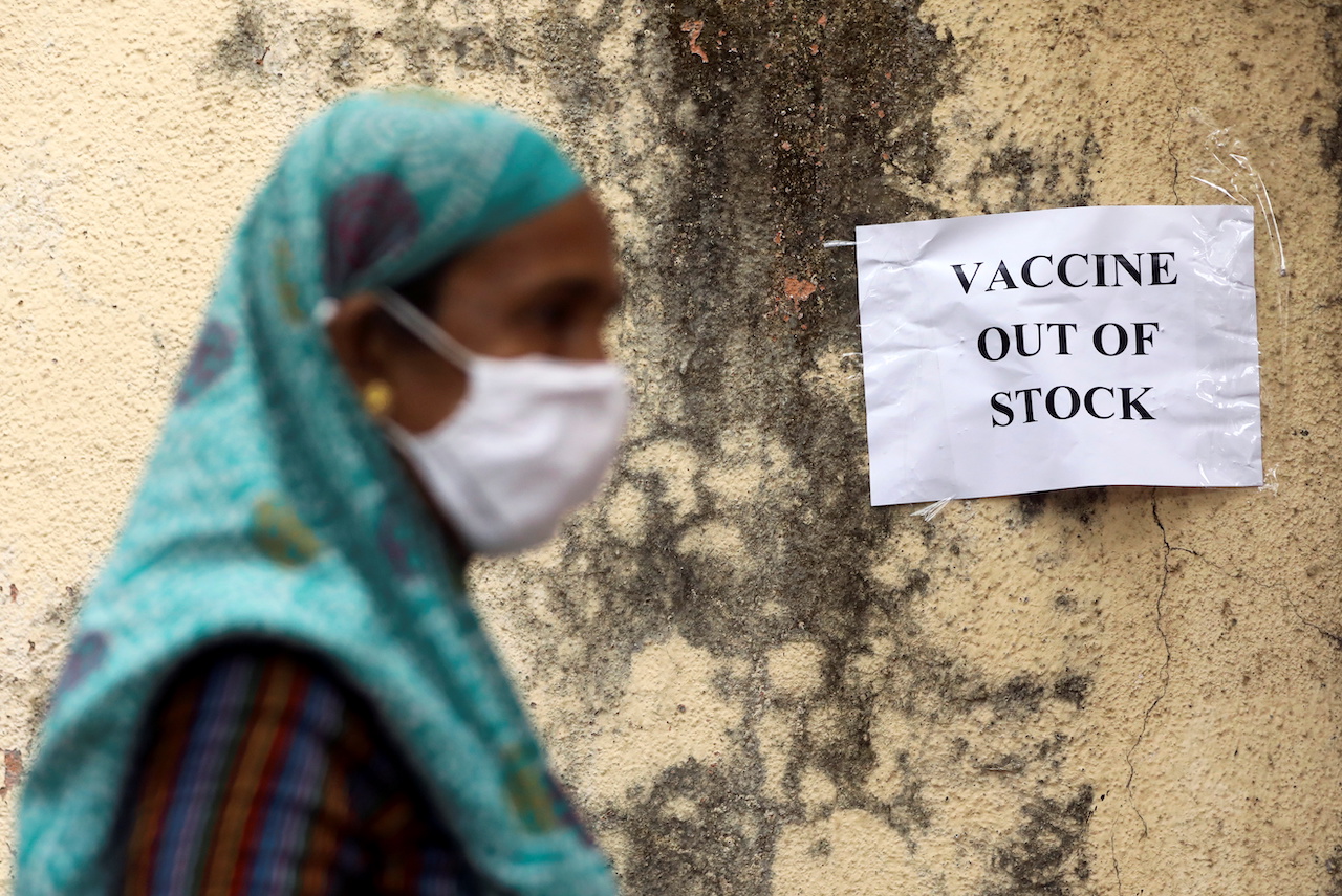A notice about the shortage of COVID-19 vaccines is seen at a vaccination site in Mumbai, India.