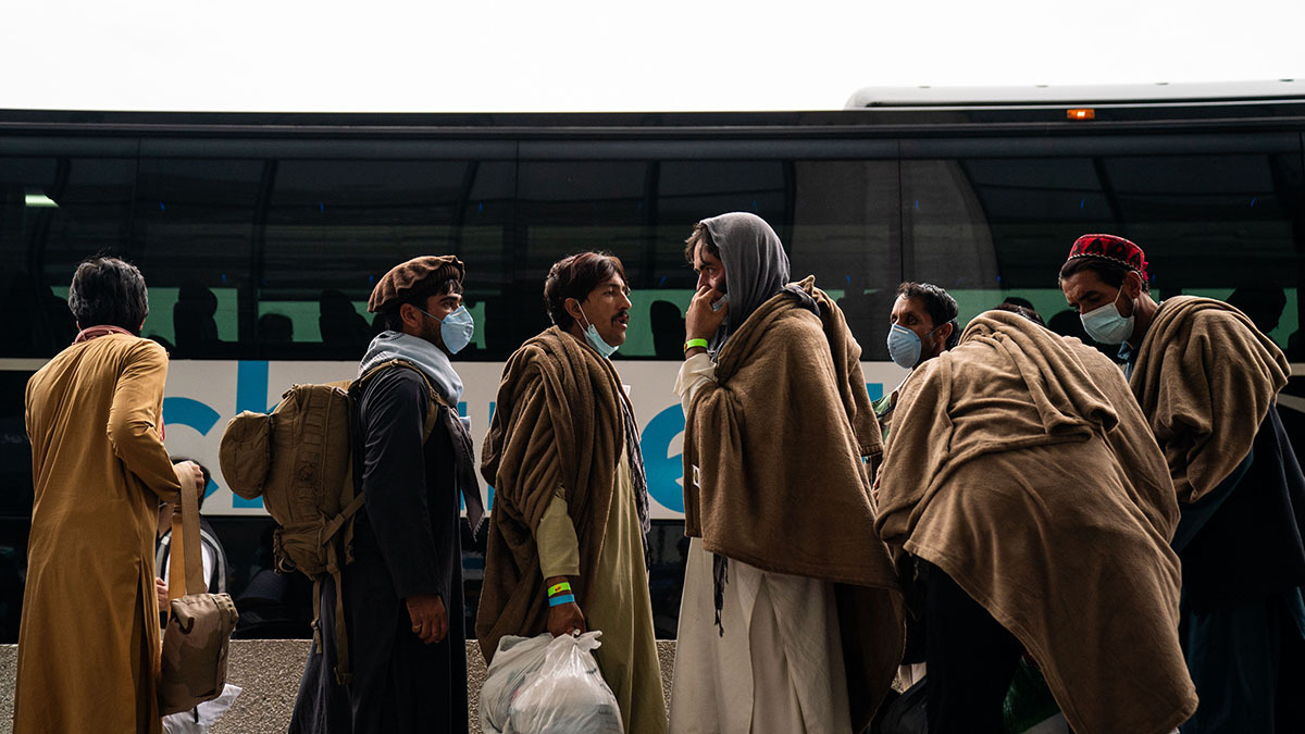 Evacuees airlifted from Afghanistan wait at Dulles International Airport near Washington, DC, in August 2021.