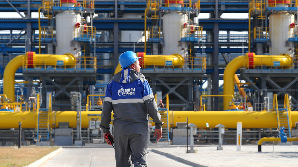 A worker for the Russian state energy company Gazprom surveys a natural gas treatment facility at the starting point of the Nord Stream 2 pipeline in northwest Russia. 