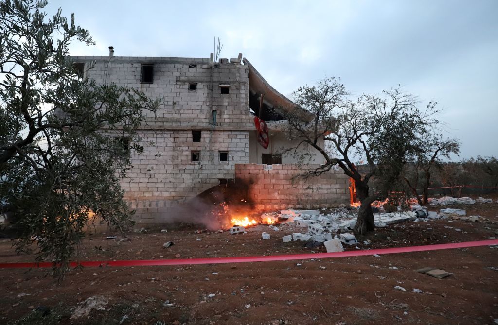 Red tape surrounds the house where Islamic State leader Abu Ibrahim al-Hashimi al-Qurayshi died during an overnight raid by U.S. special forces in Syria’s Idlib province.
