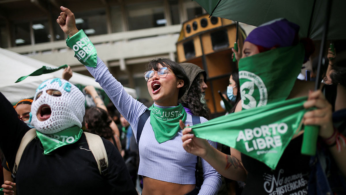 Women wearing green bandanas demonstrate in front of Colombia’s constitutional court in support of removing abortion from the penal code.