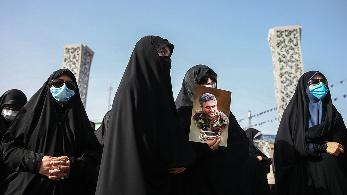 People attend the funeral of Colonel Hassan Sayyad Khodaei on May 24, 2022, in Tehran.