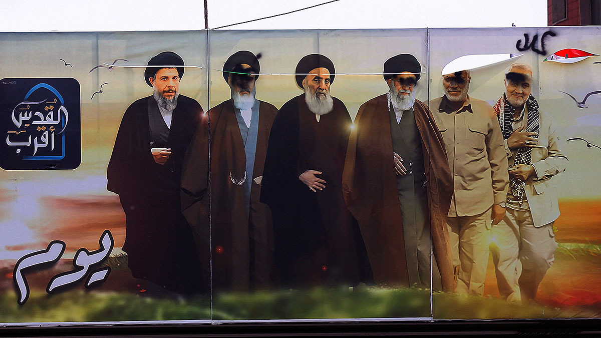 A poster shows defaced images of Supreme Leader Ali Khamenei and other Iranians, while the images of Iraqis including Grand Ayatollah Ali al-Sistani are untouched.