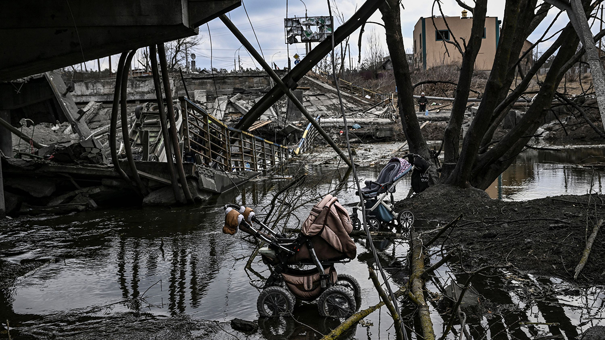 Abandoned strollers are pictured under a destroyed bridge as people flee the city of Irpin, west of Kyiv.