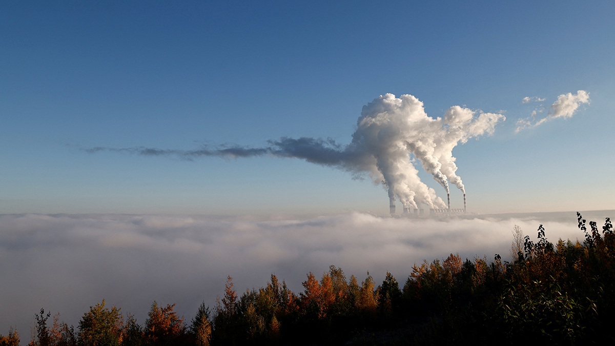 Smoke rises over the clouds from power plants in Poland
