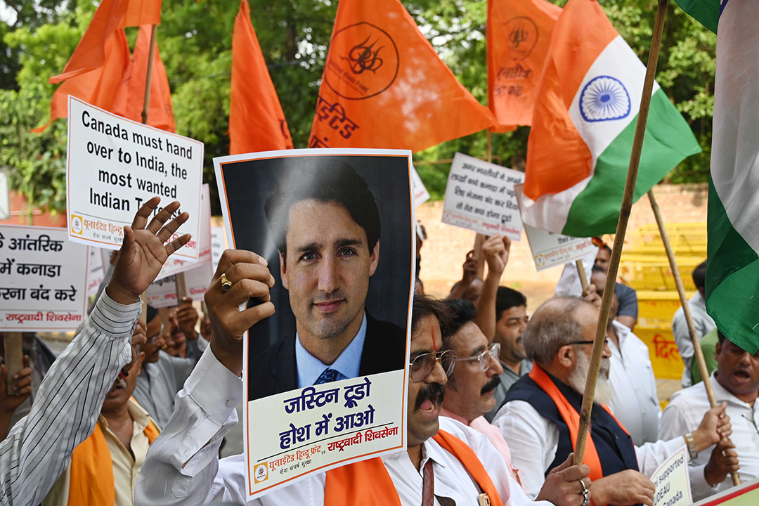 Supporters from United Hindu Front hold placards to protest against the Canadian Prime Minister Justin Trudeau on the prevailing situation upon Khalistani organizations in the parts of Canada at Jantar Mantar, on September 24, 2023 in New Delhi, India