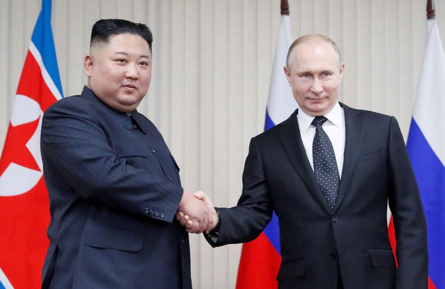 North Korean leader Kim Jong Un and Russian President Vladimir Putin shake hands during a bilateral meeting.