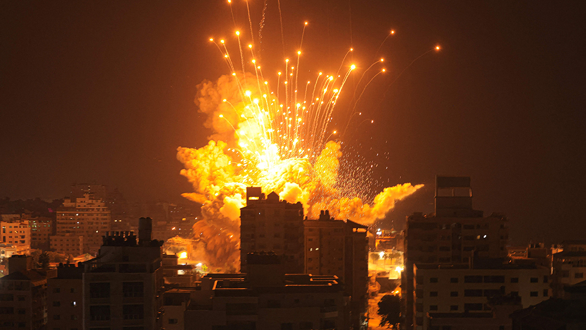A missile explodes in Gaza City during an Israeli air strike.