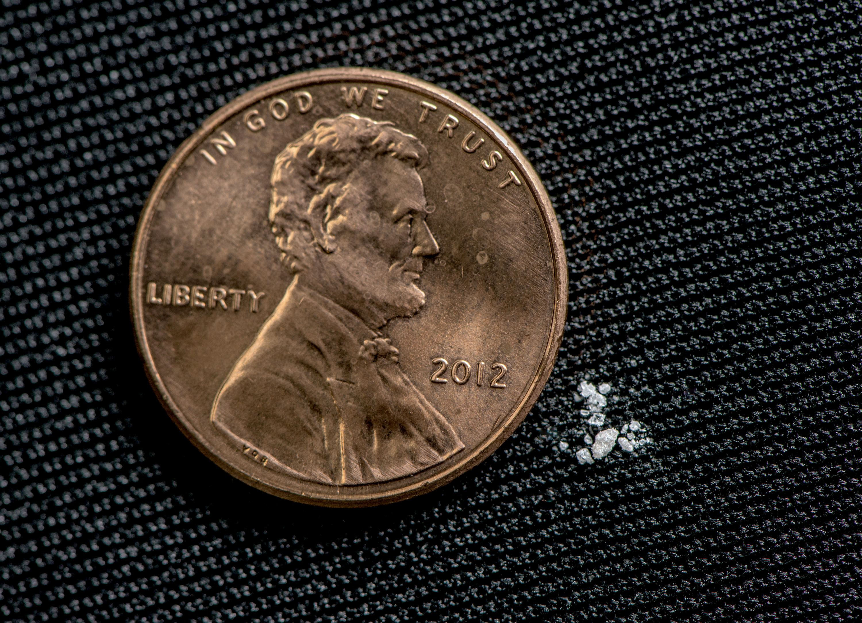 Two milligrams of fentanyl, considered a lethal dose, compared to the size of a penny.