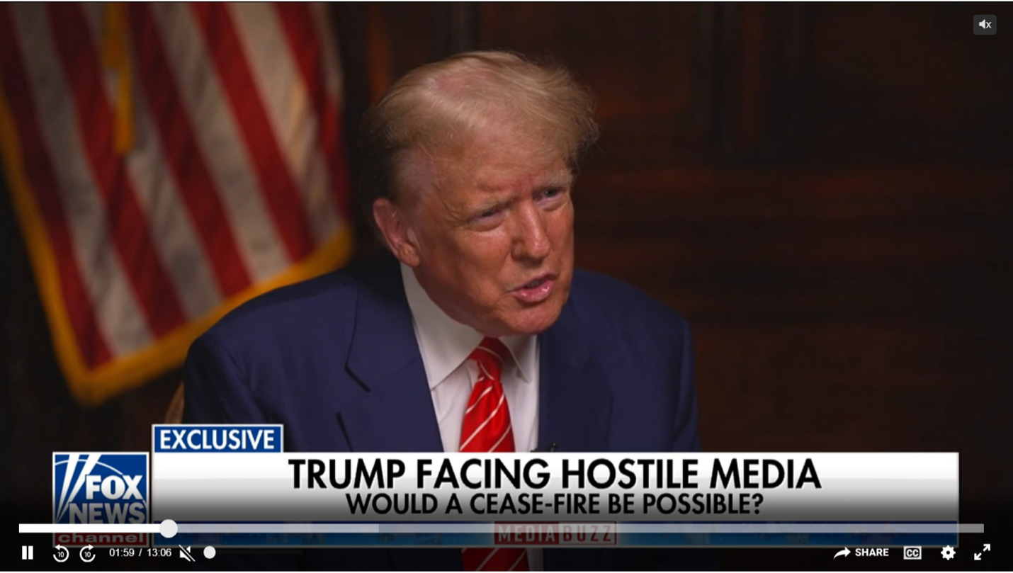 Trump as viewed speaking in front of the American flag. 