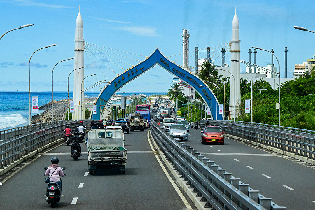 Drivers cross the China-funded Sinamalé Bridge, also called the China-Maldives Friendship Bridge.