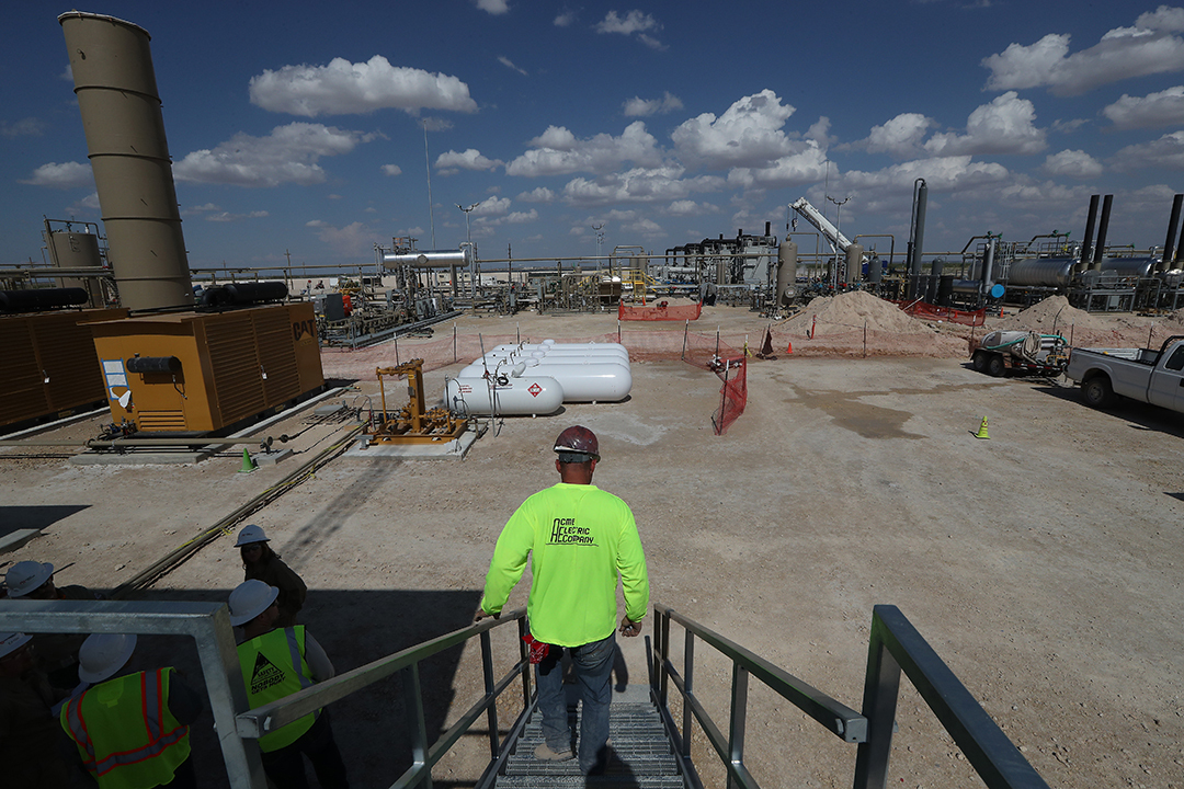Noble Energy employees work at a fracking site in Pecos, Texas, in 2017.