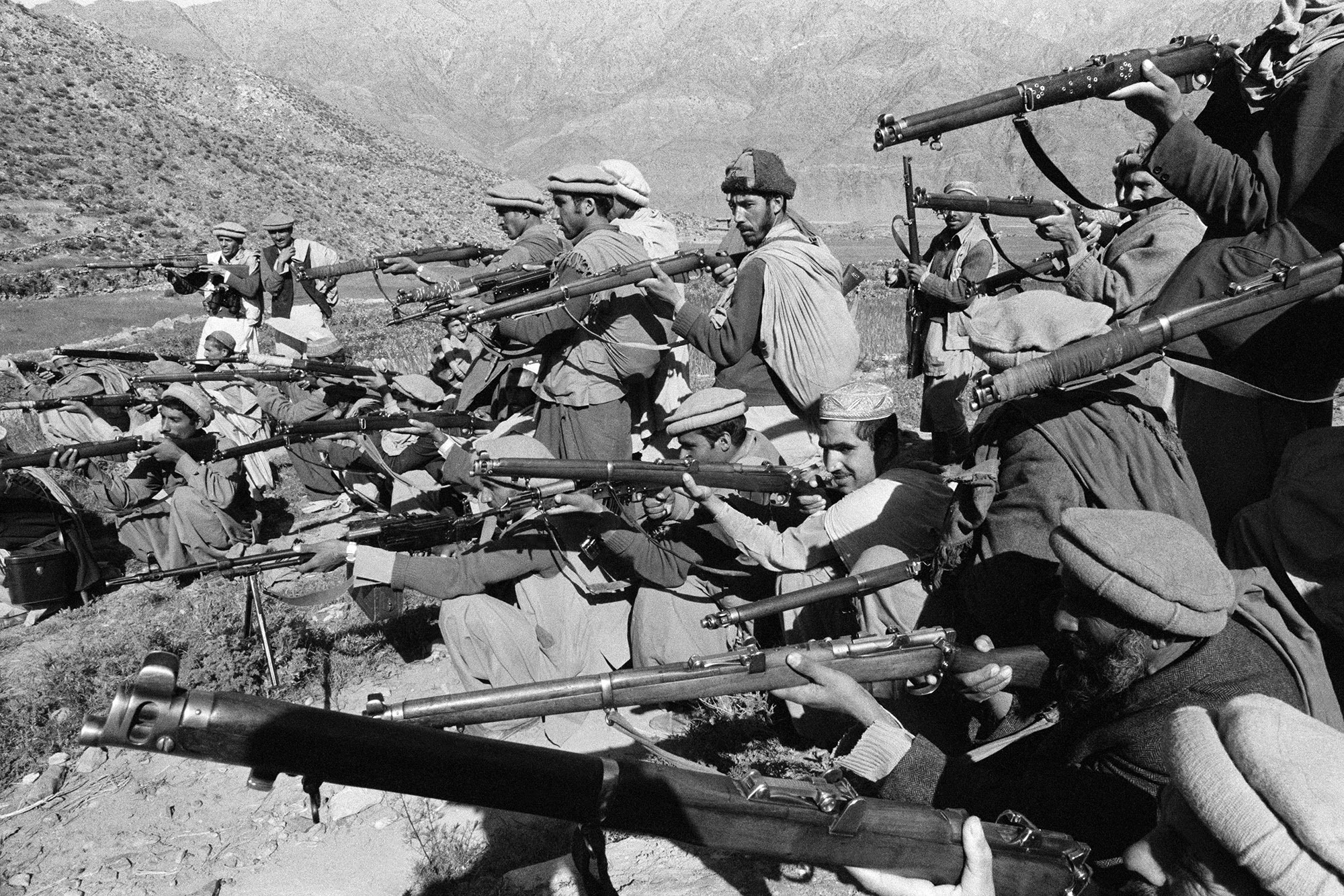 Mujahideen fighters pose with their weapons in the mountains of Afghanistan in 1979.