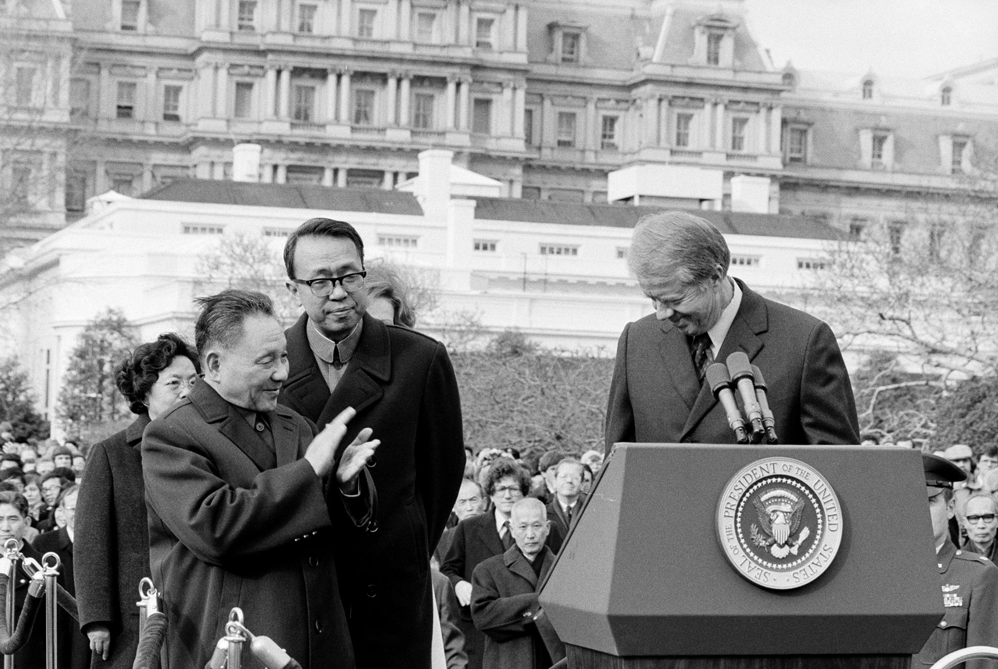 Chinese leader Deng Xiaoping applauds during remarks by Carter at the White House in January 1979.