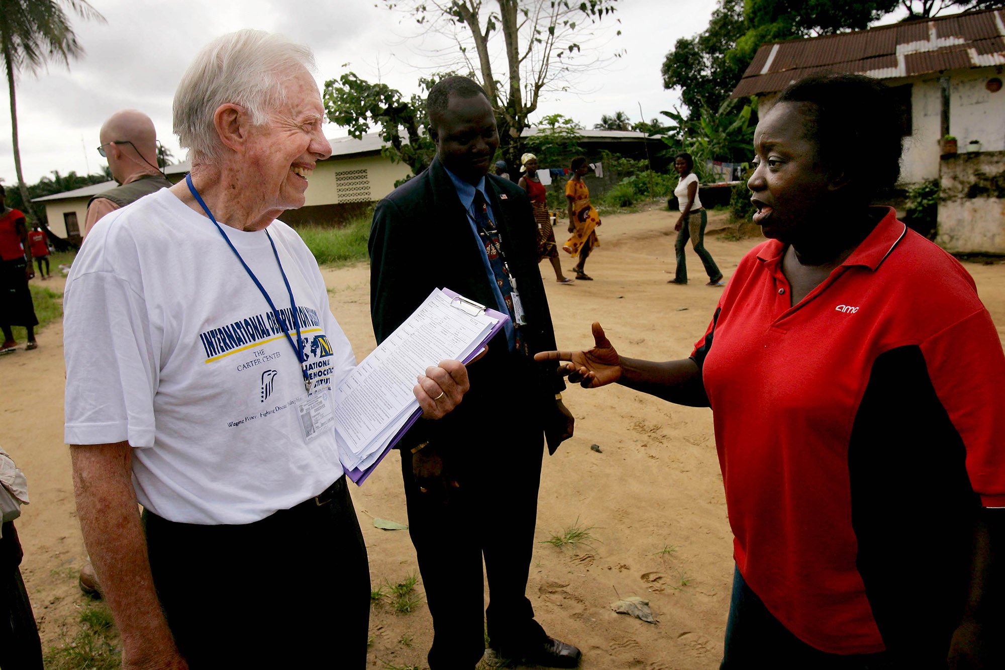Former President Carter speaks with voters during a Carter Center mission to observe Liberia’s October 2005 elections.