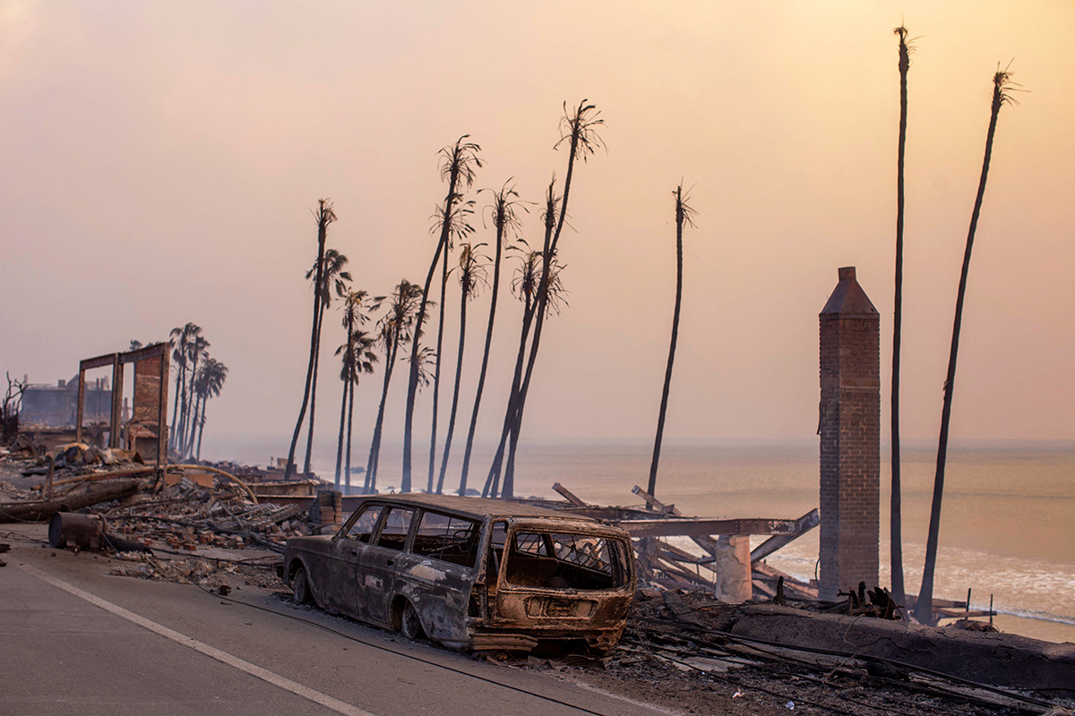 Burned vehicles are seen in Malibu as the Palisades fire burns during a windstorm on the west side of Los Angeles, California, U.S. January 8, 2025.