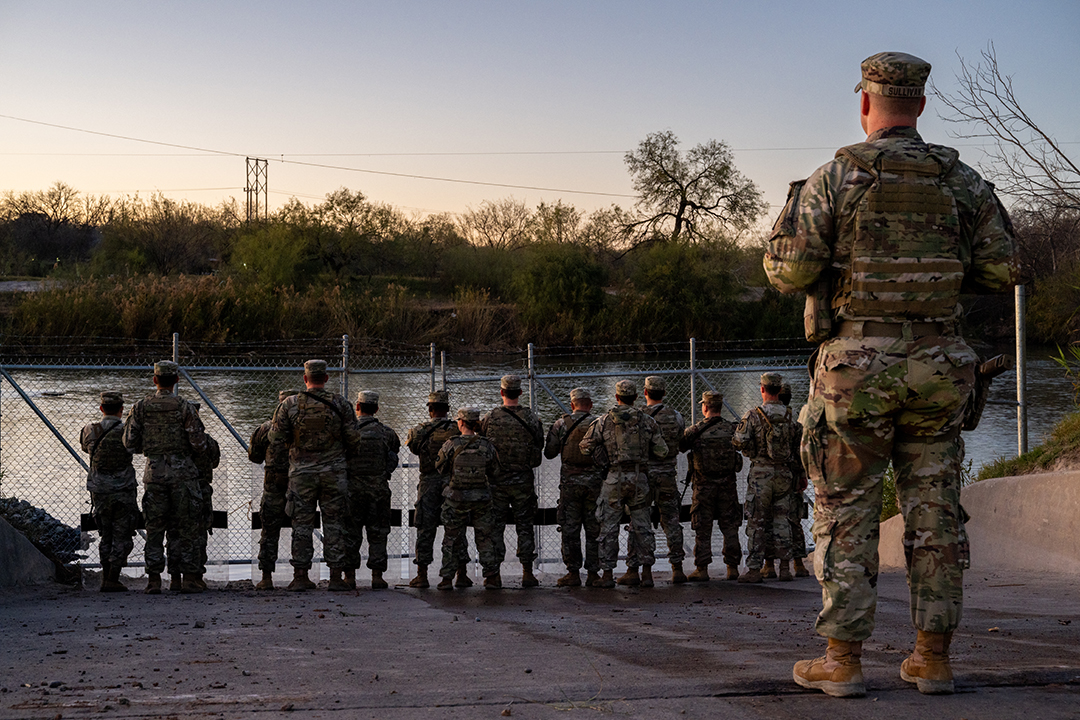 National Guard soldiers stand guard on the banks of the Rio Grande River at Shelby Park in Eagle Pass, Texas, on January 12, 2024.