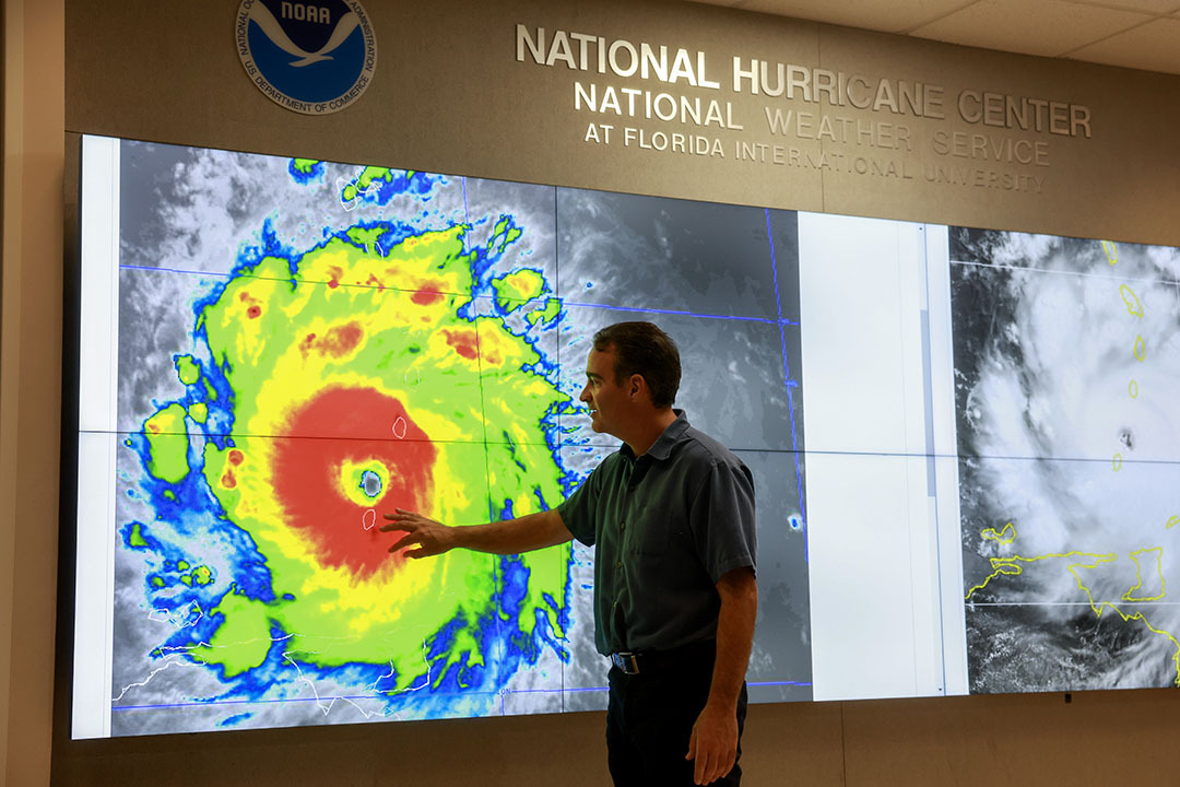 John Cangialosi, Senior Hurricane Specialist at the National Hurricane Center, inspects a satellite image of Hurricane Beryl, the first hurricane of the 2024 season, at the National Hurricane Center on July 01, 2024 in Miami, Florida.