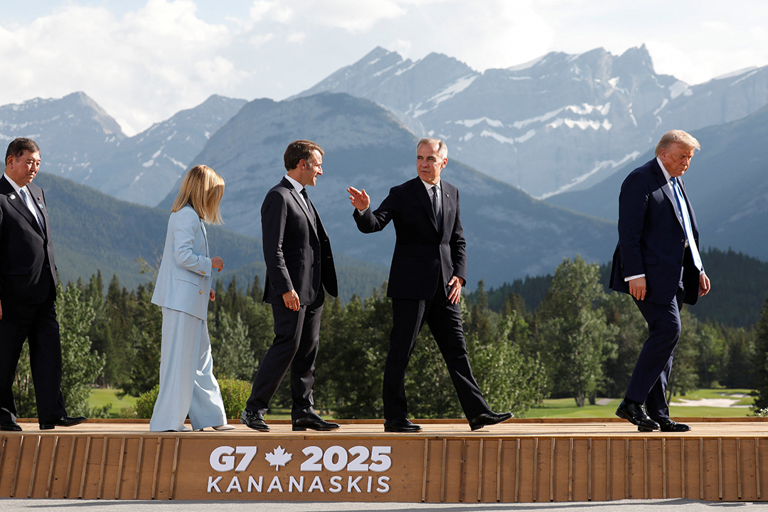 Japan's Prime Minister Shigeru Ishiba, Italy's Prime Minister Giorgia Meloni, France's President Emmanuel Macron, Canada Prime Minister Mark Carney, and U.S. President Donald Trump walk after posing for a photo at the G7 Summit in June.