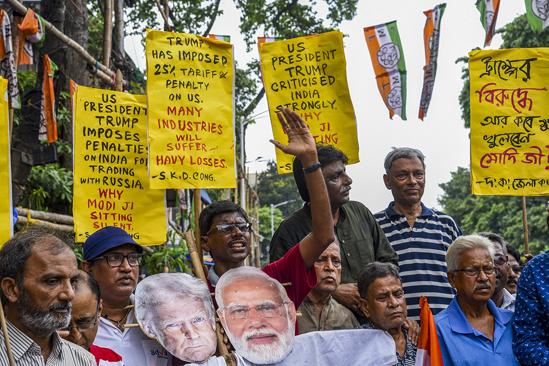 Activists burn an effigy of President Trump and Prime Minister Modi as they protest against the U.S. tariff announcement in Kolkata, India, August 1. Debajyoti Chakraborty/Middle East Images/AFP/Getty Images
